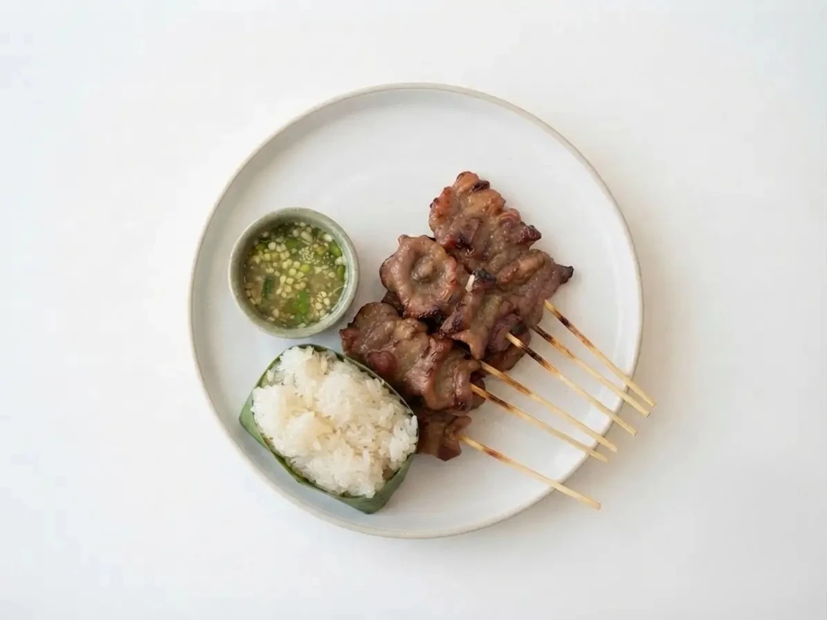 Grilled pork skewers served with sticky rice at Kin Dee Street Kitchen in northeast Calgary